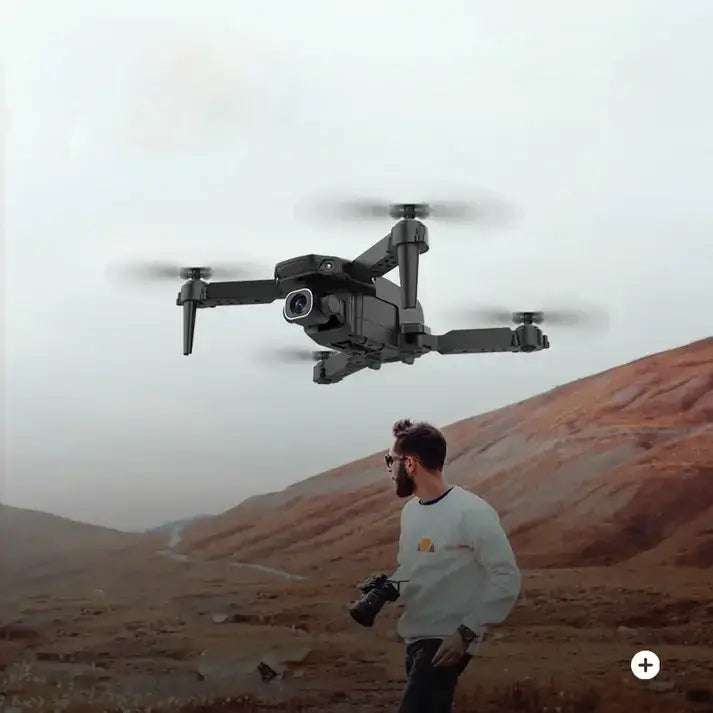 90098 Foldable Quadcopter in flight with 4K dual cameras, capturing high-definition aerial footage