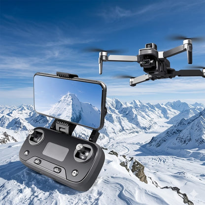 A promotional photo of the W5 Long-Range GPS Drone system. In the foreground, a black remote controller with an attached smartphone displays a clear FPV (first-person view) live video feed of snow-capped mountains on its screen. In the upper-right, 